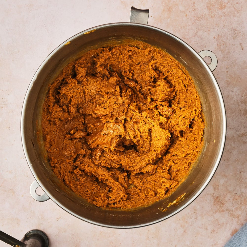 Vegan ginger cookie dough in the bowl of a stand mixer.