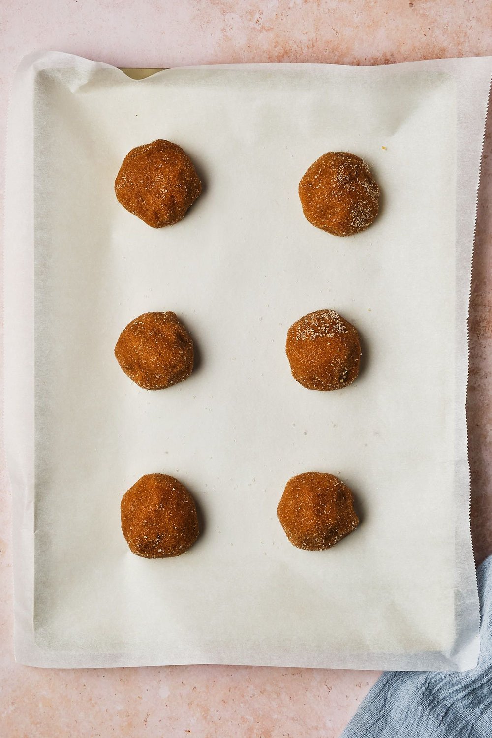 A tray of vegan ginger cookies before baking.