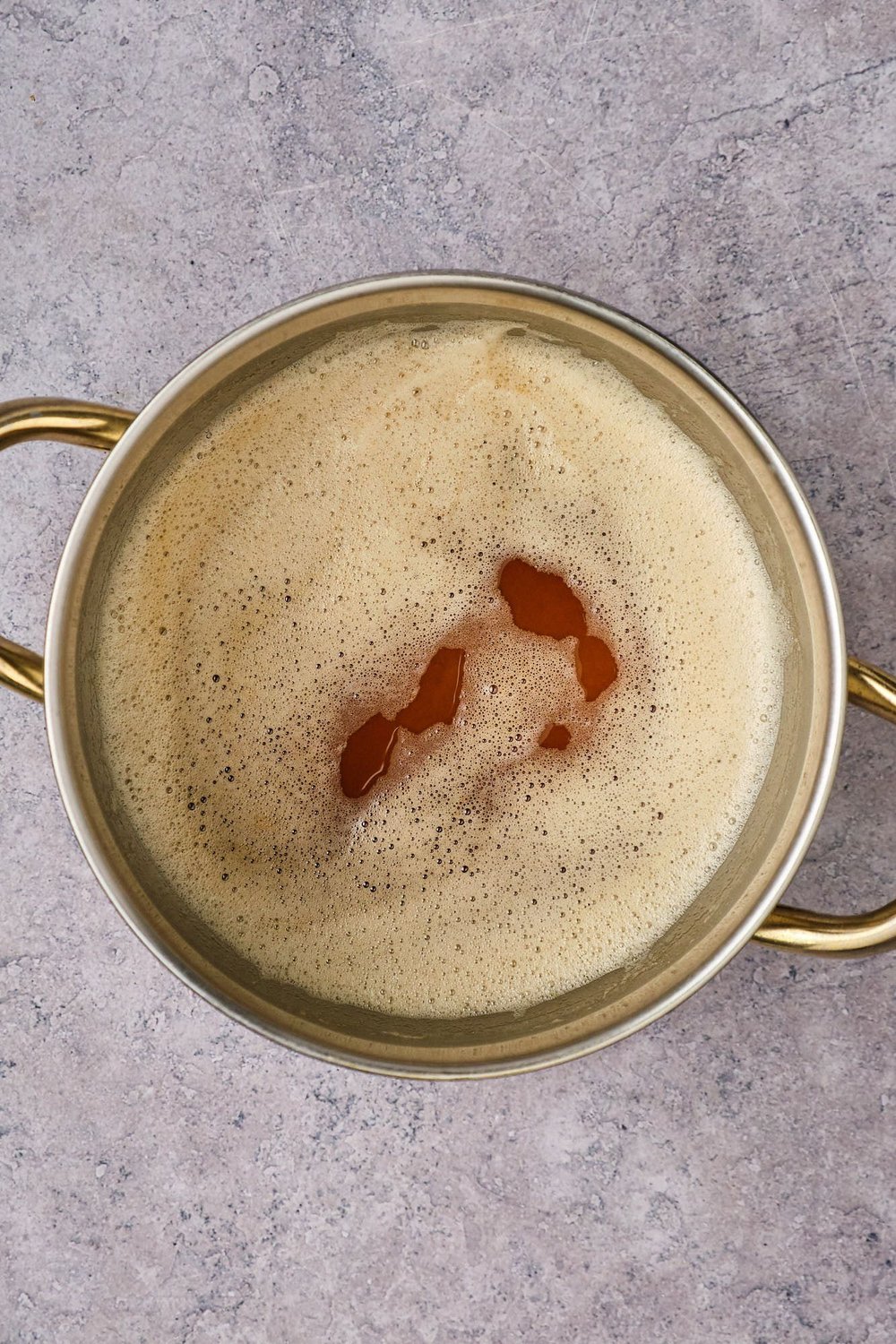 A top-down view of vegan brown butter and miso in a pot.
