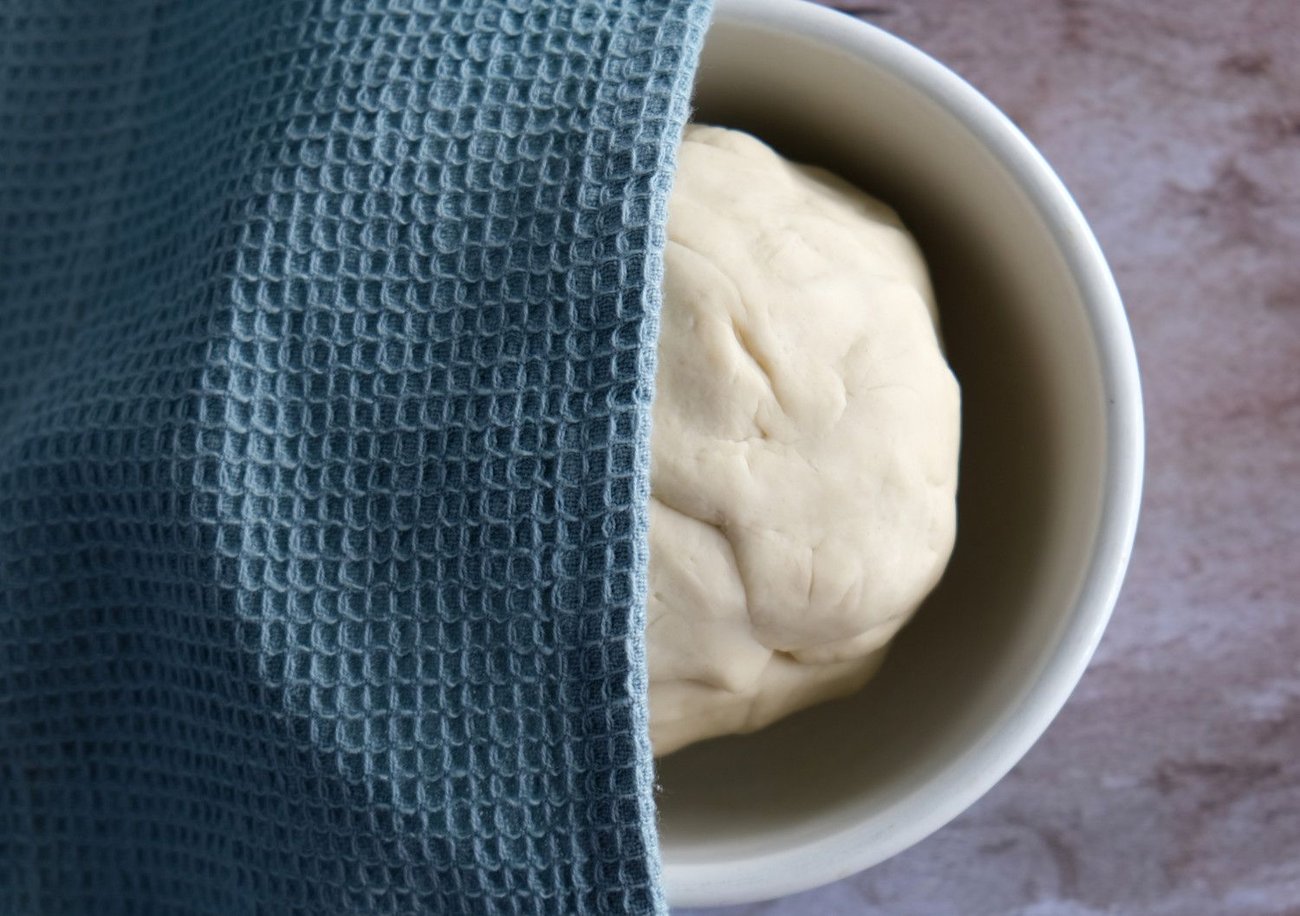 Cover your ravioli dough with a damp towel so it doesn't dry out as it's resting.