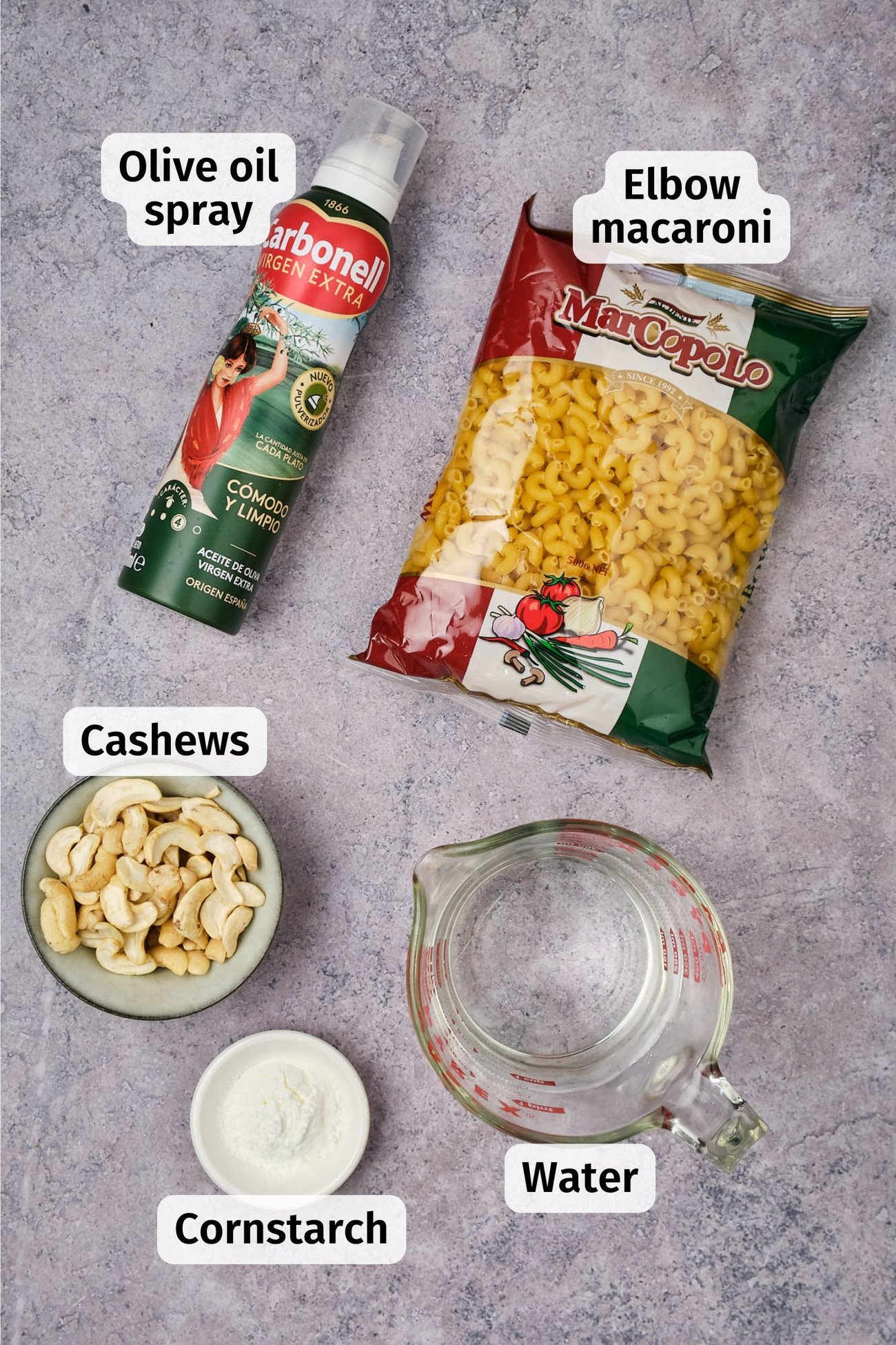 The non-cheese ingredients for vegan mac and cheese on a table, labeled.