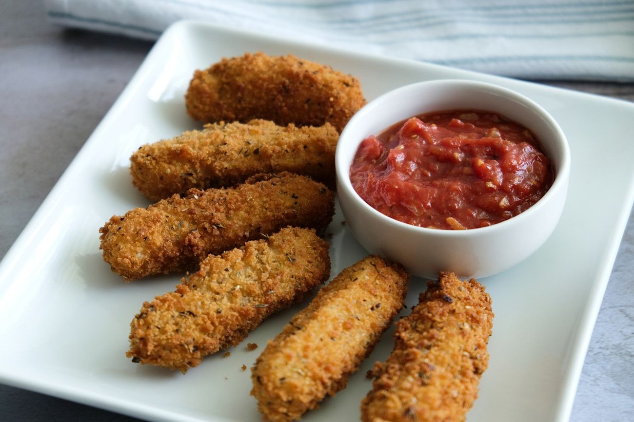 Spicy marinara dipping sauce is the perfect accompaniment for these mozzarella sticks. 
