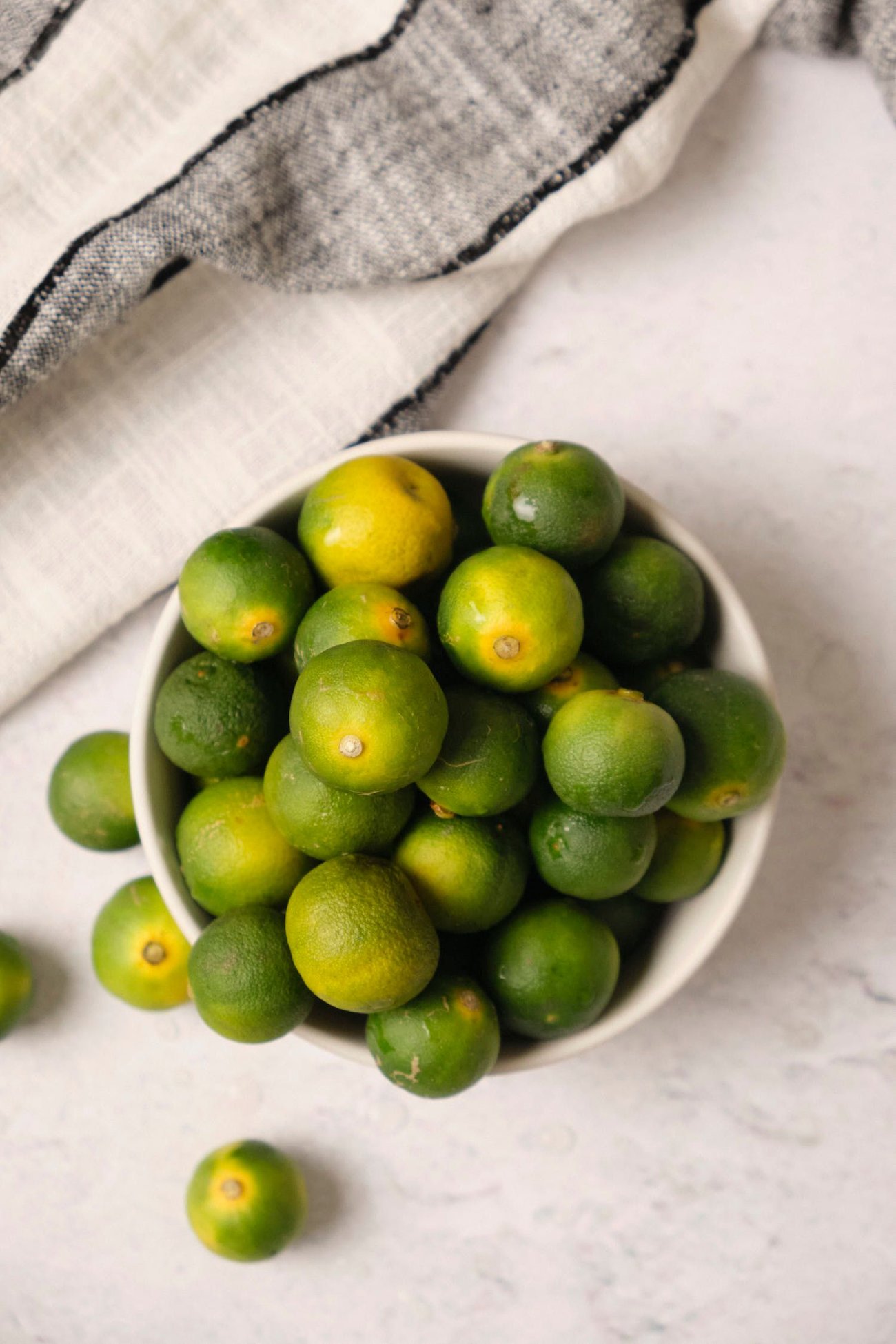 Allow your Key limes to ripen before you try to juice them. Ripe Key limes are softer and produce more juice than unripe limes.