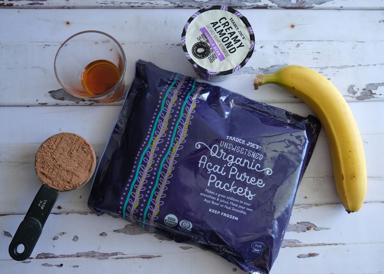 This chocolate açaí smoothie is made with an unsweetened açaí packet, a banana, non-dairy yogurt, cacao powder, and maple syrup.