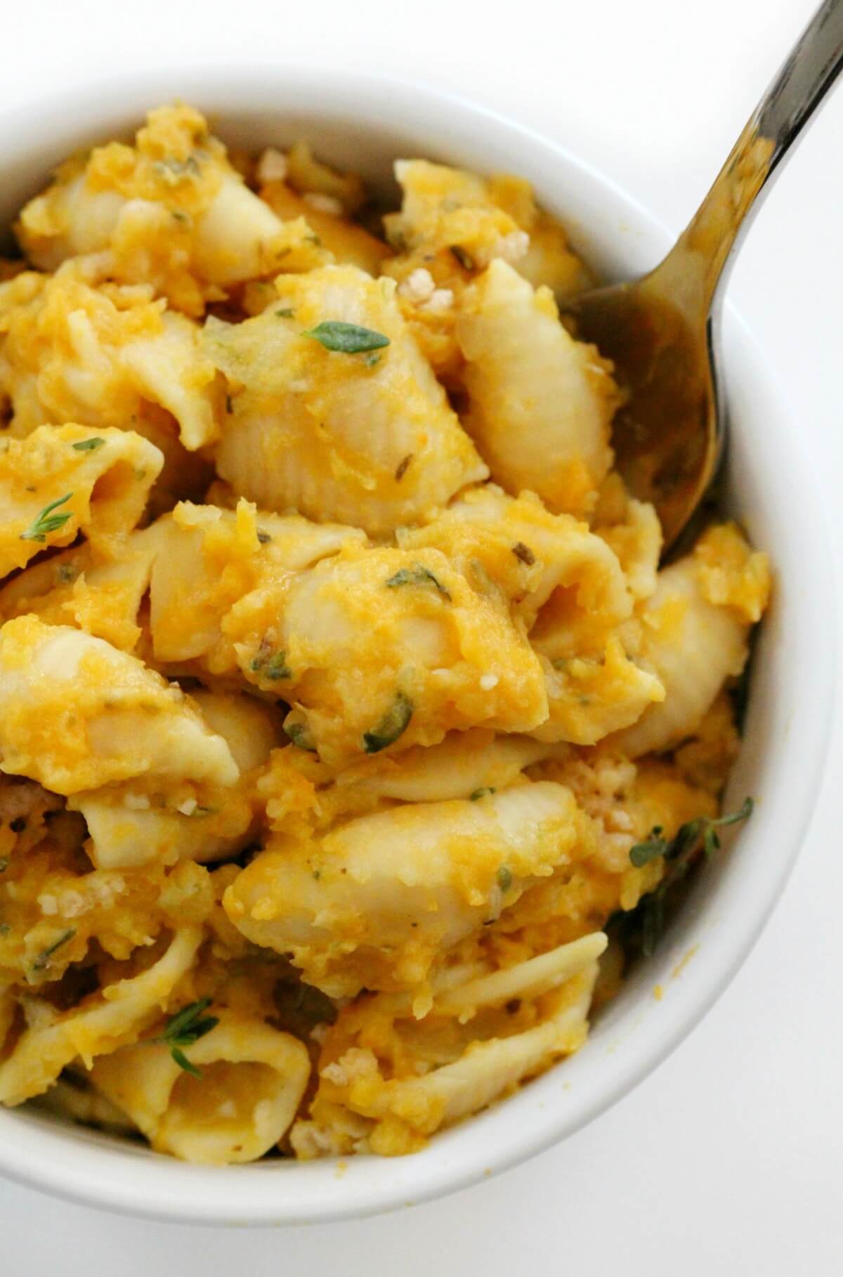Vegan Butternut Squash Mac and Cheese in a bowl with a spoon. 