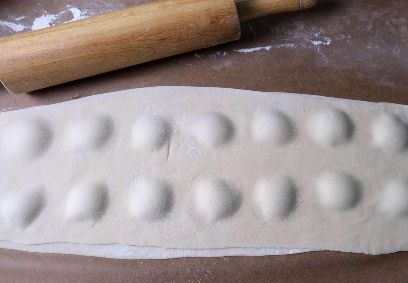 When placing the second pasta sheet on top, work from one side to the other so you can push out any air bubbles as you go.