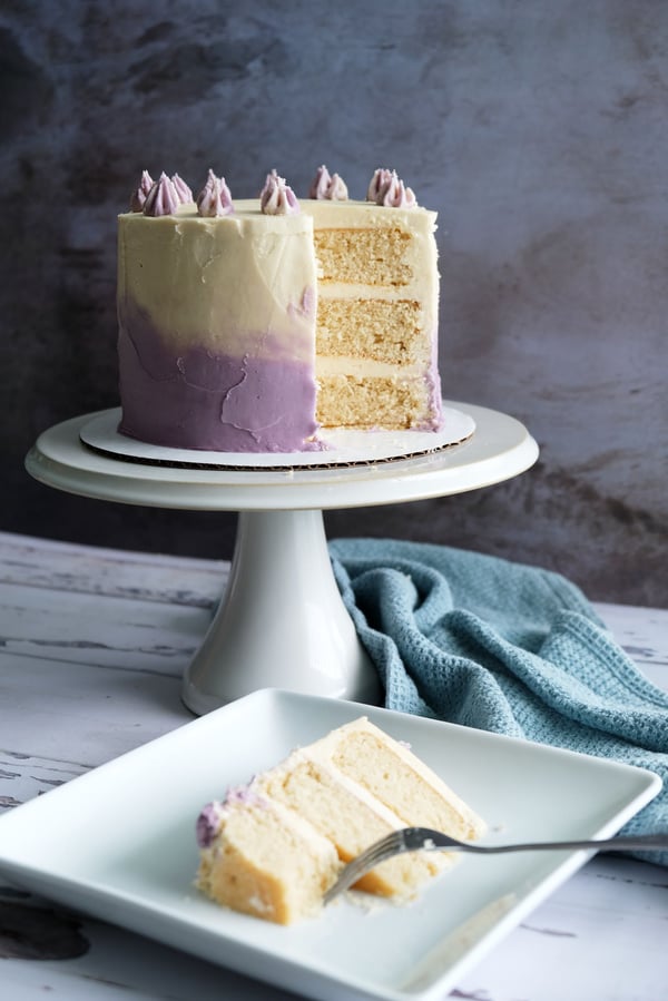 vegan vanilla cake with slice in foreground
