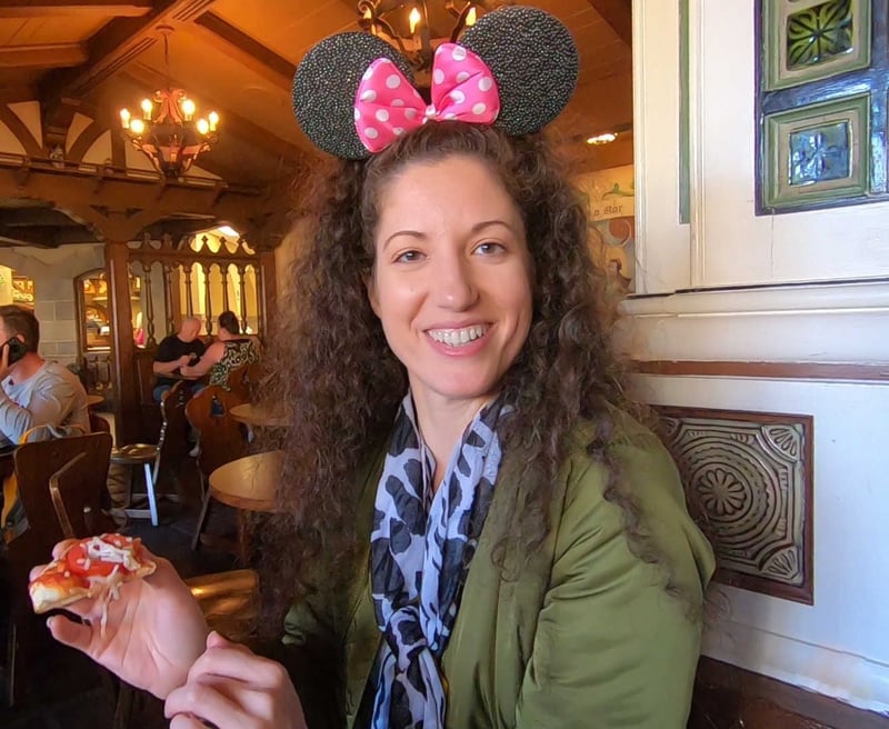 Steph eating a vegan margherita pizza at Pinocchio Village Haus