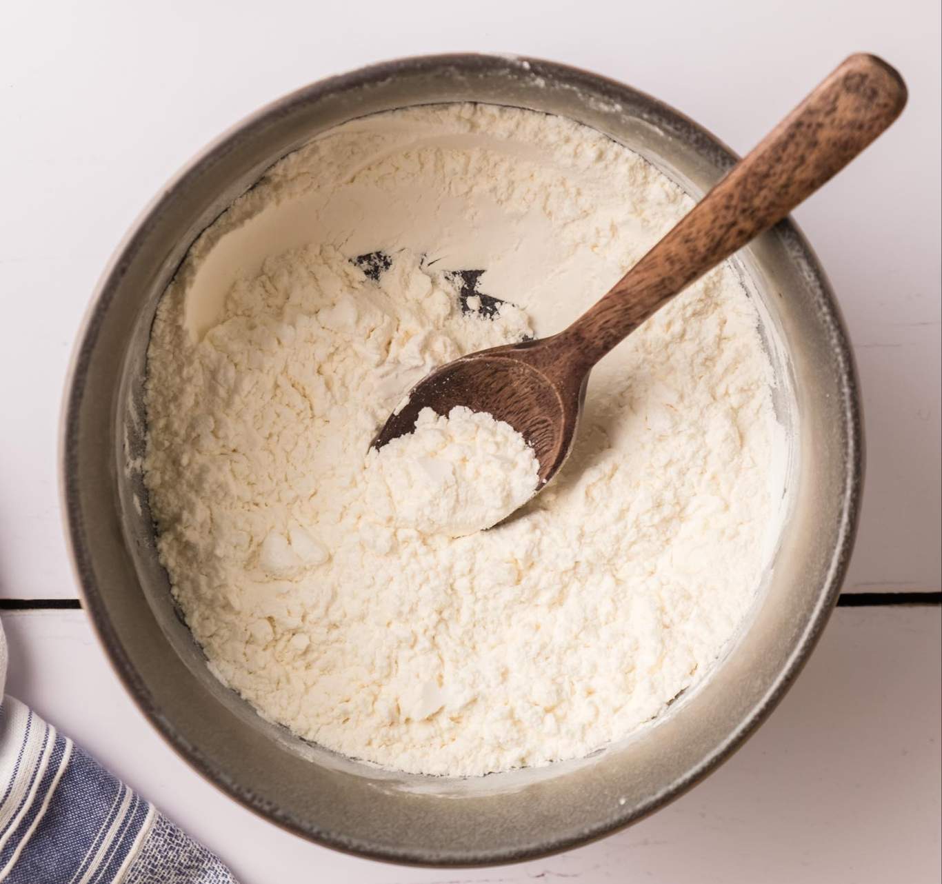 Coating mix, mixed together in a bowl with a spoon.